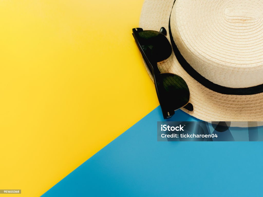 summer accessories and minimal flat lay concept from vintage hat and sunglasses decorate on pastel and colorful background Bag Stock Photo
