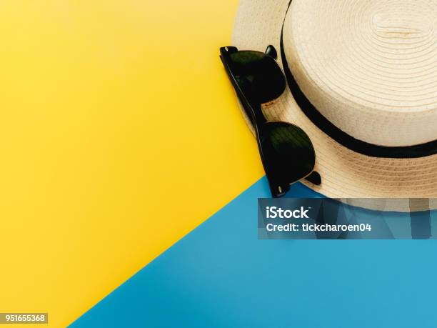 Summer Accessories And Minimal Flat Lay Concept From Vintage Hat And Sunglasses Decorate On Pastel And Colorful Background Stock Photo - Download Image Now