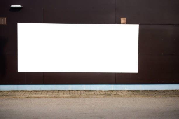 istock Mock up. Blank vertical billboard, poster frame, advertising on the the wall. 951658712