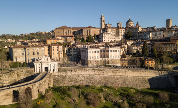 Drone aerial view of Bergamo, The Old city. One of the beautiful city in Italy. Landscape to the old gate San Giacomo and historical buildings Drone aerial view of Bergamo, The Old city. One of the beautiful city in Italy. Landscape to the old gate San Giacomo and historical buildings bergamo stock pictures, royalty-free photos & images