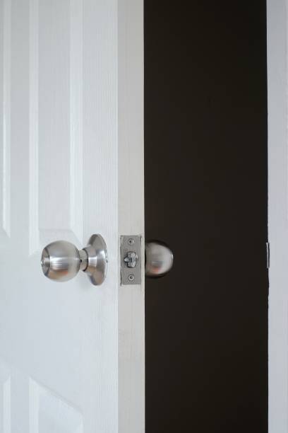istock closeup door knob on white door black background 951665242