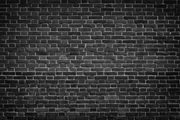 istock Dark grey brick wall texture - urban grunge black masonry background 951666074