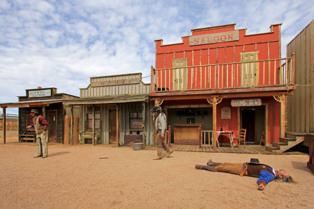 Actors playing the O.K. Corral gunfight shootout in Tombstone, Arizona, USA on March 4, 2014 TOMBSTONE, ARIZONA, USA, MARCH 4, 2014: Actors playing the O.K. Corral gunfight shootout on rebuilt stage in Tombstone, Arizona USA on March 4, 2014 wild west gunfight stock pictures, royalty-free photos & images