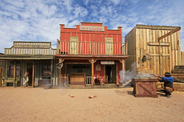 Actors playing the O.K. Corral gunfight shootout in Tombstone, Arizona, USA on March 4, 2014 TOMBSTONE, ARIZONA, USA, MARCH 4, 2014: Actors playing the O.K. Corral gunfight shootout on rebuilt stage in Tombstone, Arizona USA on March 4, 2014 wild west gunfight stock pictures, royalty-free photos & images