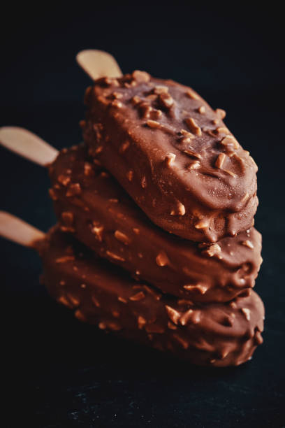 istock Vanilla Ice Cream with Chocolate on a Stick 951667012