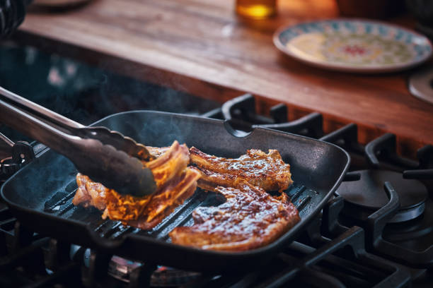 istock Roasting Lamb Chops in a Grill Cooking Pan 951667224