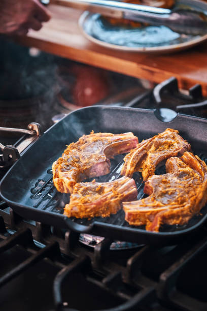 istock Roasting Lamb Chops in a Grill Cooking Pan 951667230