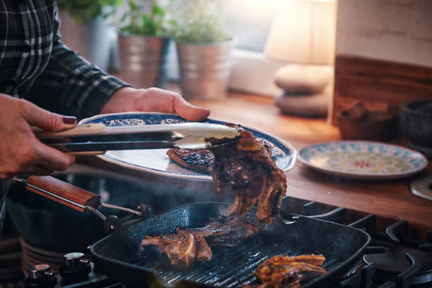 istock Roasting Lamb Chops in a Grill Cooking Pan 951667242