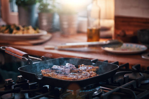 istock Roasting Lamb Chops in a Grill Cooking Pan 951667254