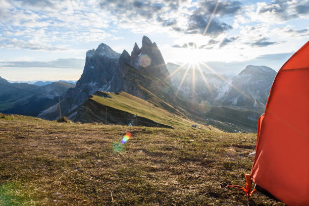 istock View from tent to mountains at sunset in summer, 951667640