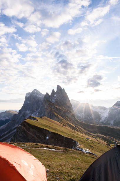 istock View from tent to mountains at sunset in summer, 951667702