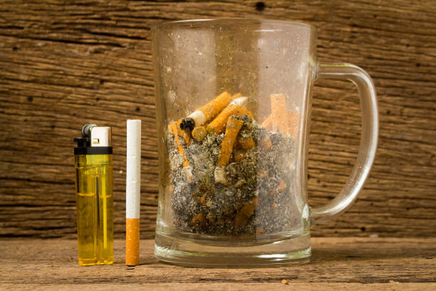 istock glass beer ashtray cigarette on old wood 951671996