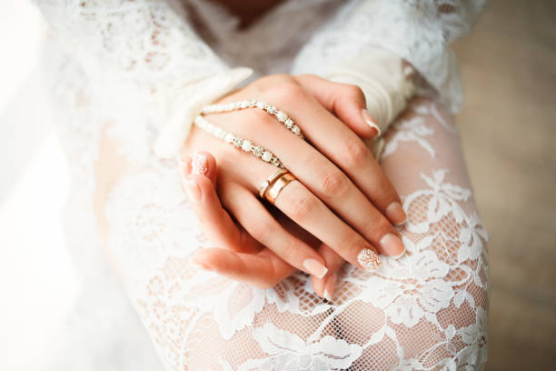 istock Gold wedding rings in the hands of bride 951675232