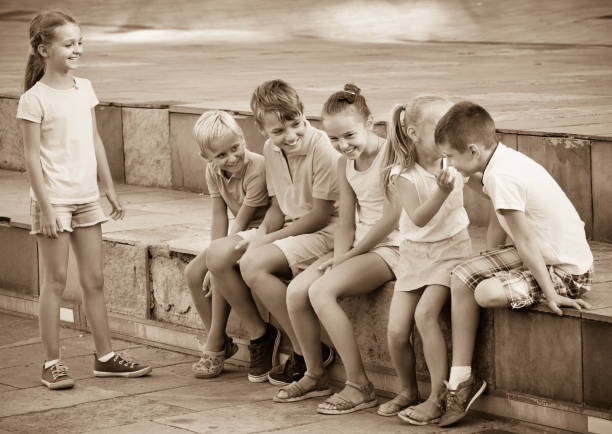 istock Cheerful boys and girls   playing charades 951675478