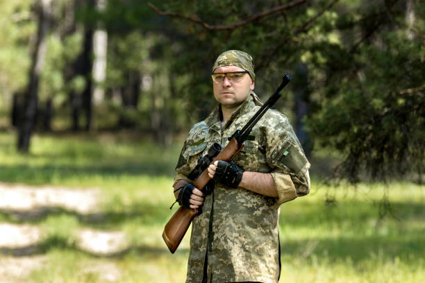 istock young man with an air rifle 951677674