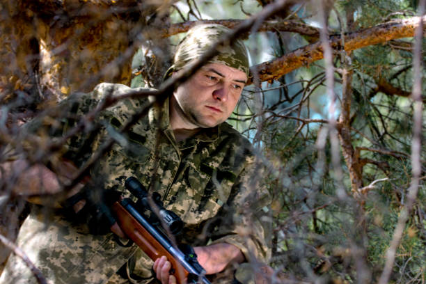 istock young man with an air rifle 951677688