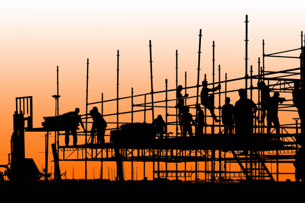 istock Silhouette of construction workers working on scaffolding 951677990