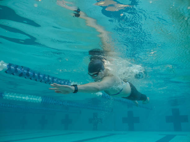 istock Adaptive athlete swims laps in a pool 951680542