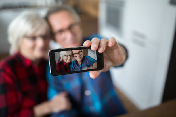 istock Senior couple taking selfie by mobile 951684968