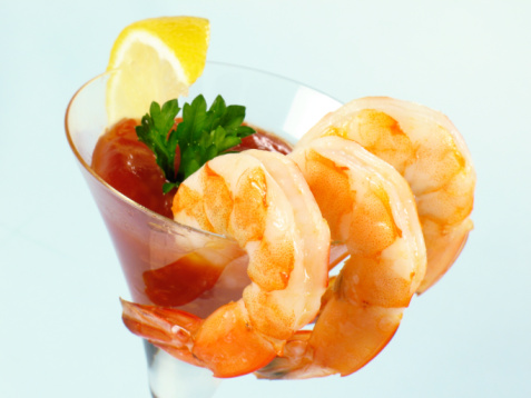 Fresh peeled and cooked shrimps  in a refrigerated counter of a fish market in southwest Florida, USA.