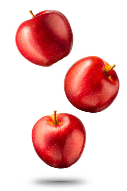 falling red apples on white background - apple red isolated cut out imagens e fotografias de stock