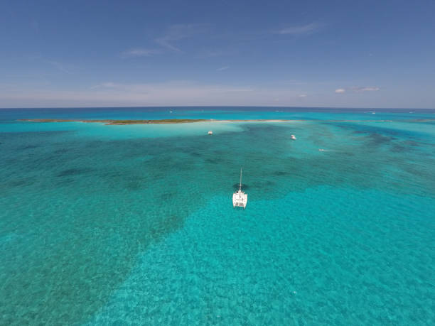 istock Catamaran Sailing Yacht Anchored at Reef 951686654