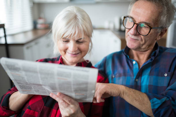 istock Senior couple reading newspaper together 951687404