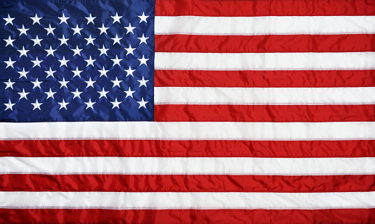 A faint faded USA flag. Apt for use as wallpapers, posters, backdrops, banners, greeting cards templates or patriotic t shirt designs for US Independence Day, 4th of July or Memorial Day. There is No people and no text and ample copy space.