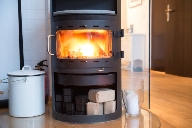 istock Small woodburning stove with blazing fire 951695012
