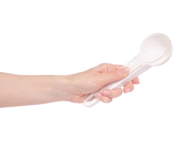 istock Spoon for ice cream in hand 951698582