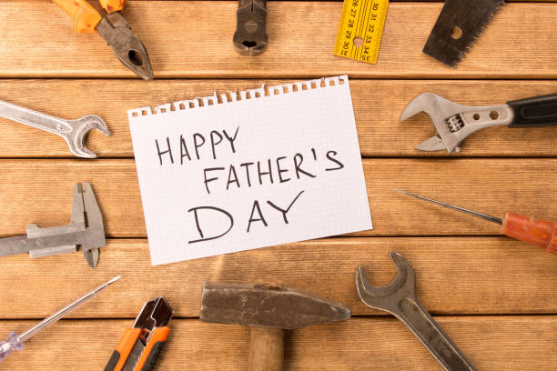istock Happy father's day . Different tools on wooden background 951700760