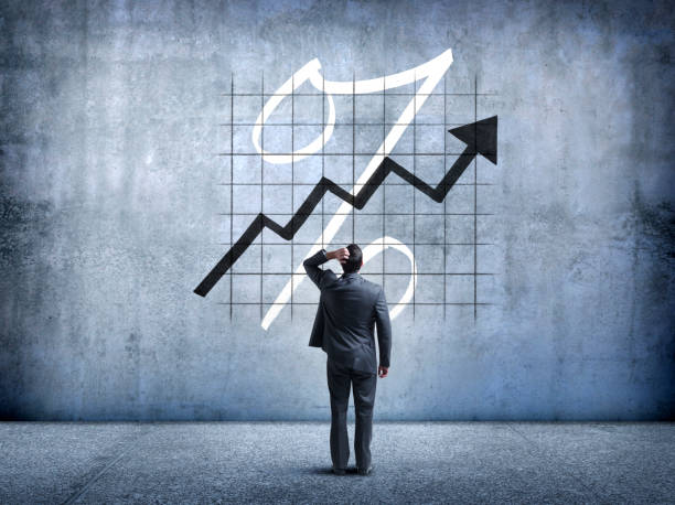 istock Businessman Looking Up At Rising Interest Rates 951713510