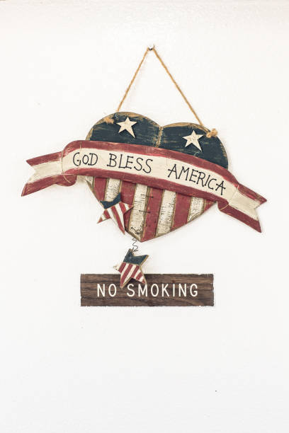 an god bless america plus no smoking sign hangs on a wall in a burger joint, kanab, utah. - bible american flag flag old fashioned imagens e fotografias de stock