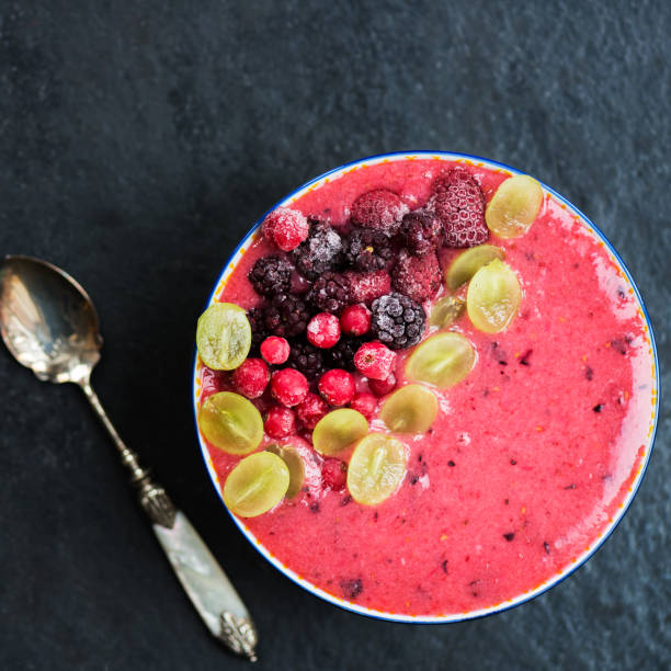 Detox Pink Smoothie from Banana and Forest Berries in the Bowl