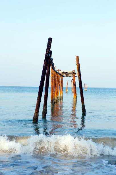 Old wooden Pilai Bridge on Natai Beach in Phang Nga Province, Thailand in the early morning.