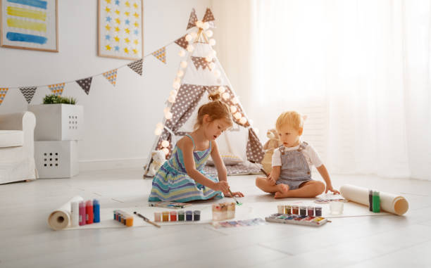 istock happy funny children paint with paint 951732324