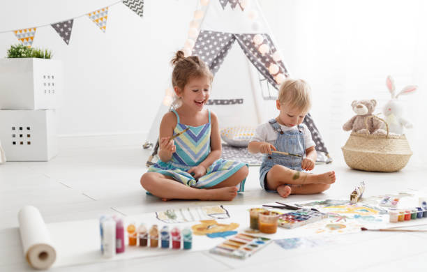 istock happy funny children paint with paint 951732516