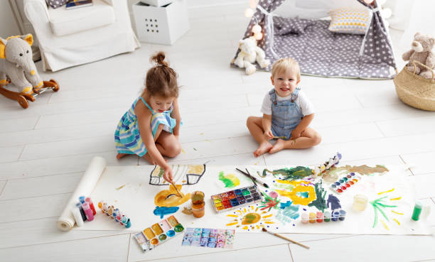 istock happy funny children paint with paint 951732662