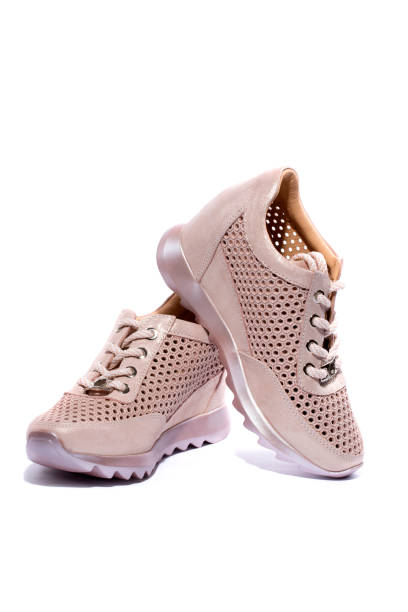 istock Pink Women's sneakers on a white background 951732706