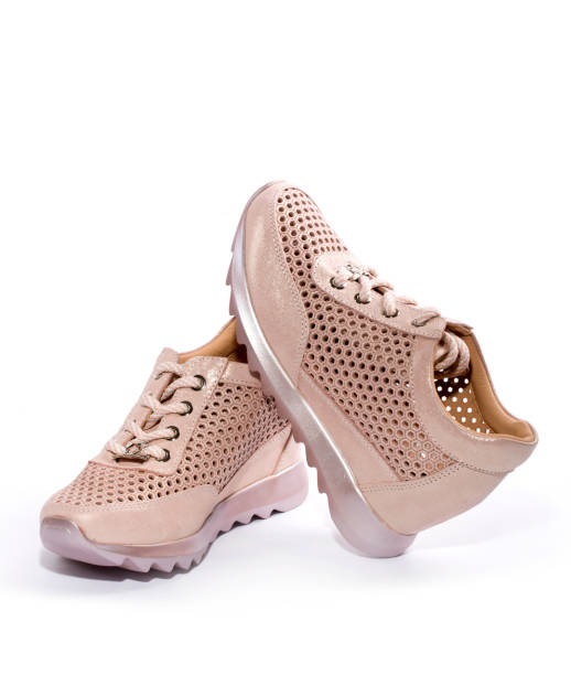 istock Pink Women's sneakers on a white background 951732720