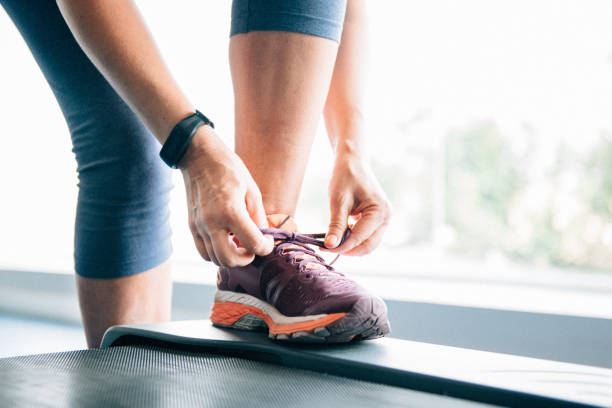 Woman exercises at the GYM wearing a Fitness Tracker