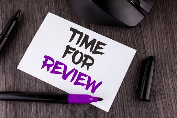 istock Handwriting text writing Time For Review. Concept meaning Giving Feedback Evaluation Rate job test or product Qualify written on White Sticky Note Paper on the wooden background Mouse Markers 951740754
