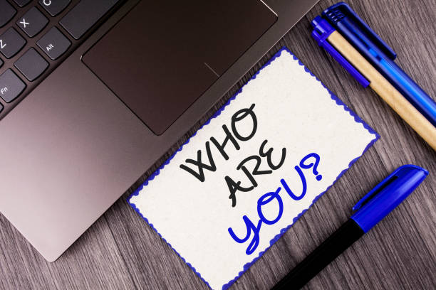 istock Word writing text Who Are You Question. Business concept for Introduce or Identify Yourself Tell your Personal Story written on White Sticky Note Paper on the wooden background Laptop Markers 951741530