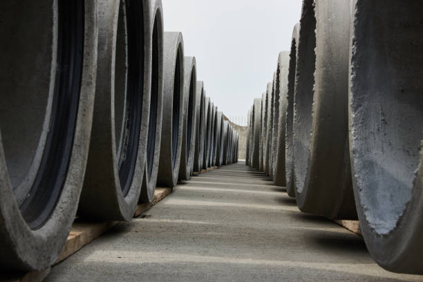 istock Stacked concrete pipes at concrete factory 951742214