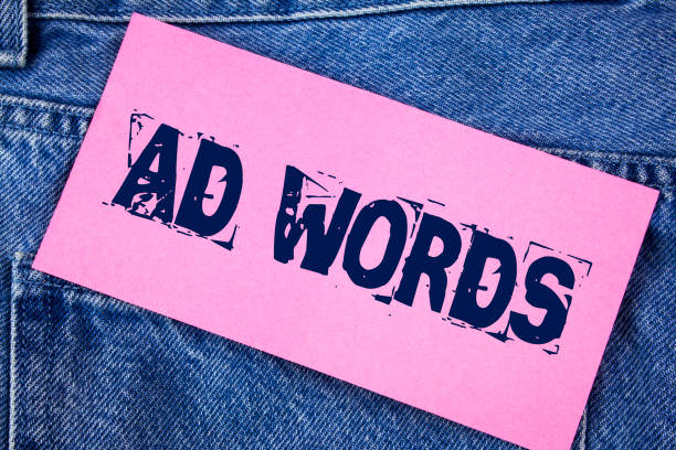 istock Handwriting text Ad Words. Concept meaning Advertising a business over first of internet search results written on Sticky Note Paper on the Jeans background. 951752280