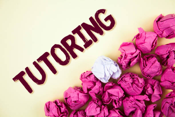 istock Text sign showing Tutoring. Conceptual photo Mentoring Teaching Instructing Preparing Supporting Give lessons written on Plain background Crumpled Paper Balls next to it. 951761256