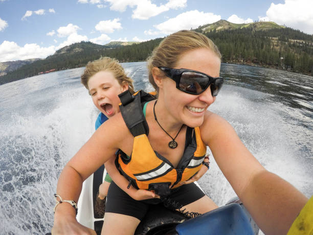 istock Mother and son selfie on a wave runner adventure 951761380