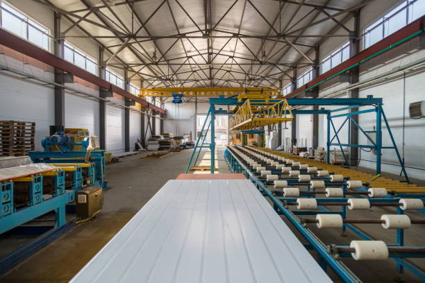 istock Insulation sandwich panel production line. Machine tools, roller conveyor and gantry crane in workshop 951772314
