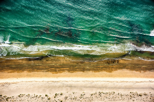 An abstract composition of a beach along the Southern California coast between San Diego and Orange Counties on Camp Pendleton shot from directly overhead at an altitude of about 1500 feet.