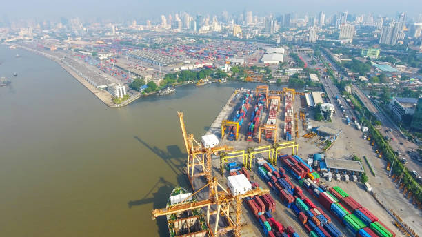 istock Logistics and transportation of Container Cargo ship and Cargo working crane bridge in shipyard 951789394